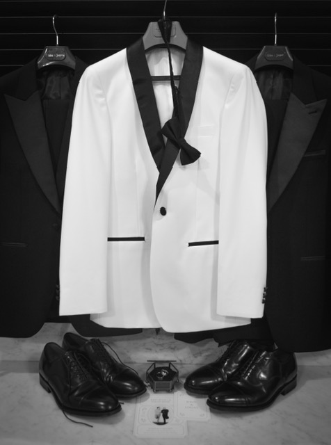 Elegant tuxedo and accessories flat lay detail shot